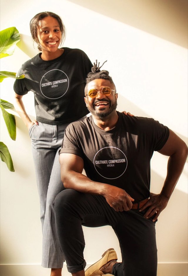 Keiko and Tobi, the Inyeon stewards, standing together in the sunlight wearing Inyeon "Cultivate Compassion" shirts.